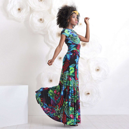 black woman in long colorful dress for paradise vacation outfit from friends fashion 